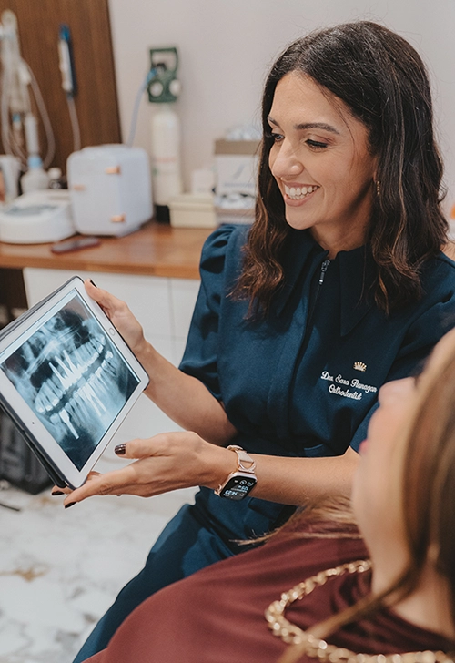 Dentist at Enhance Dental Dublin examining patient x-ray